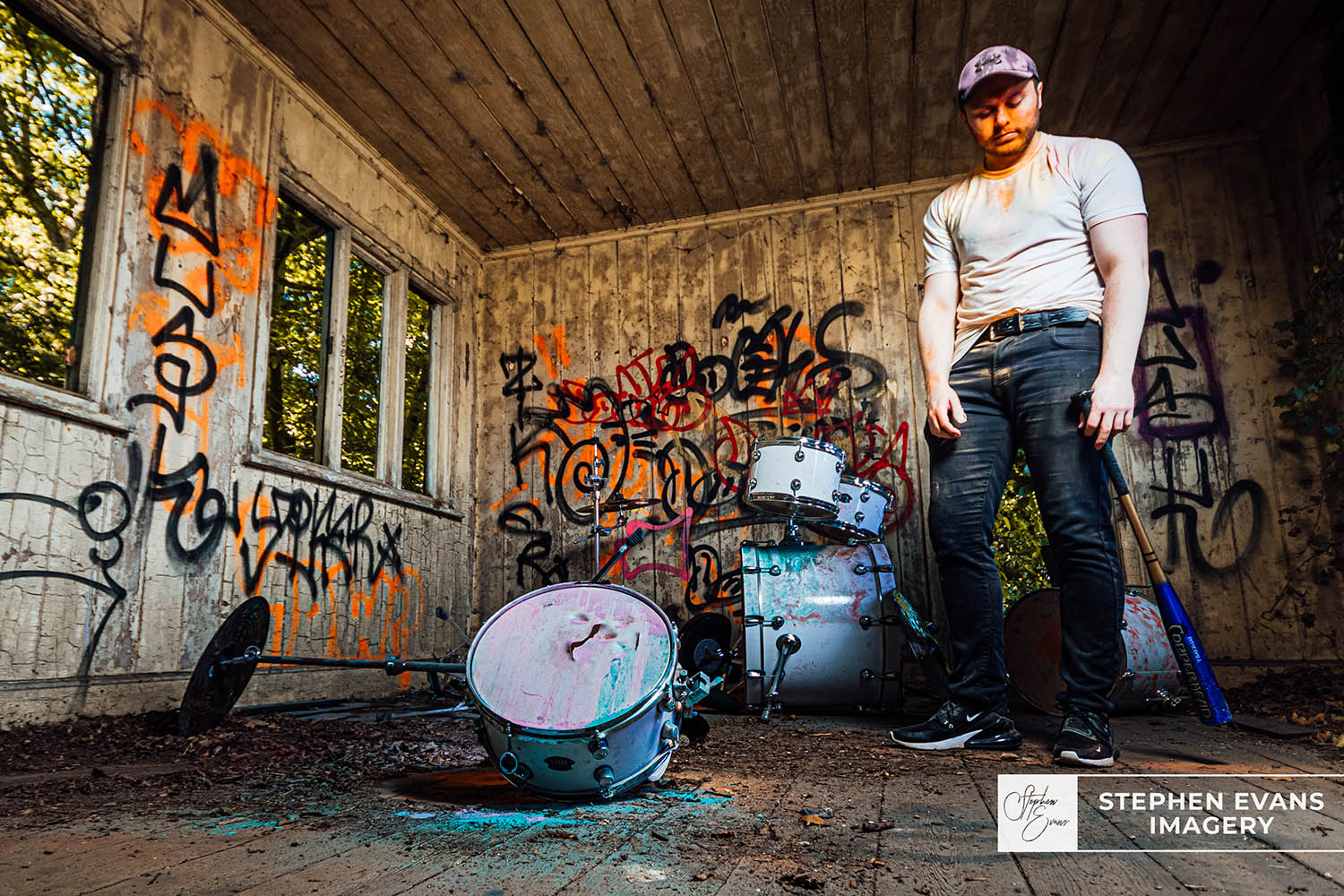 Drummer Joe creating paint powder explosion during performance