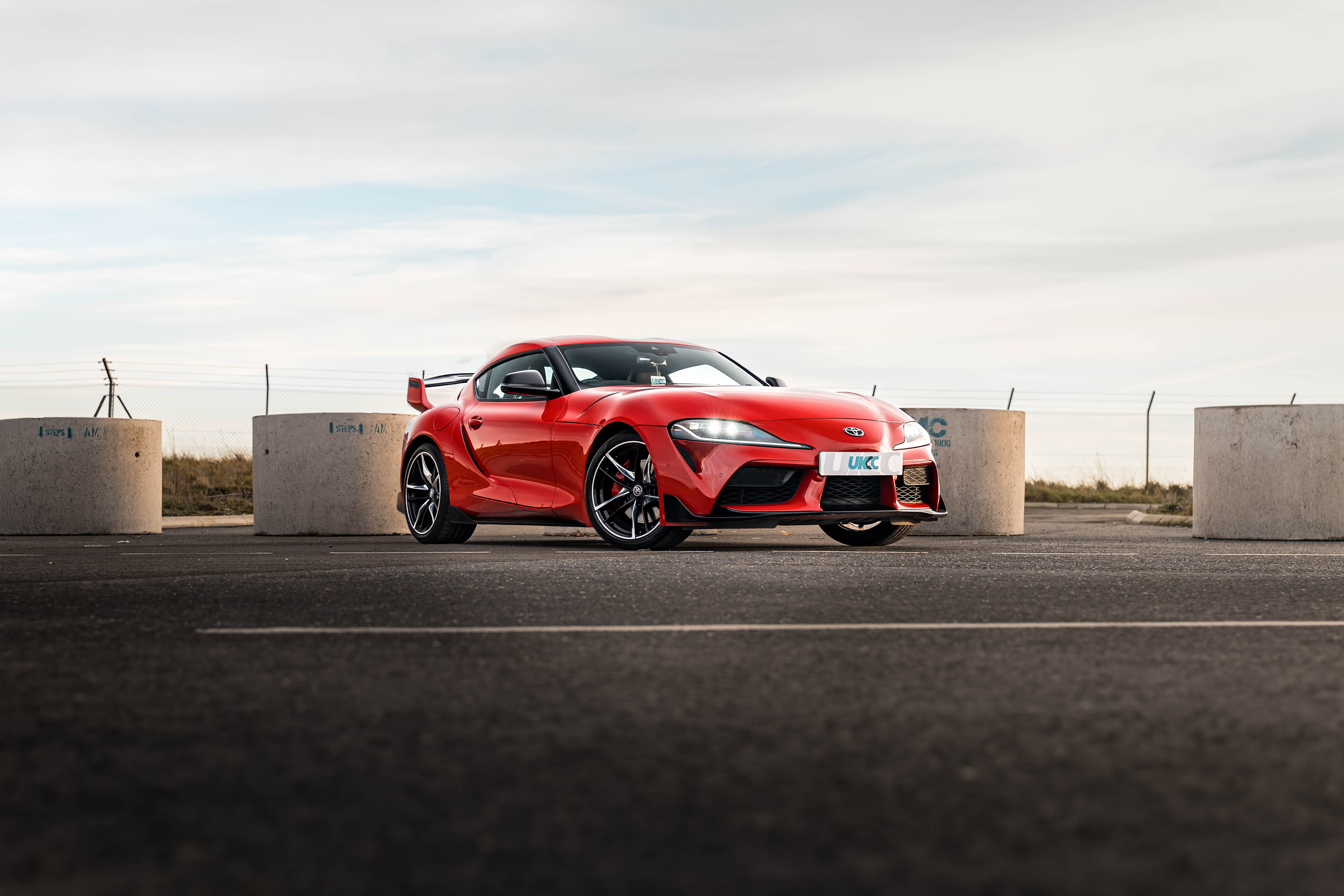 UKCC Red Toyota Supra outside Norwich Airport raffle competition car